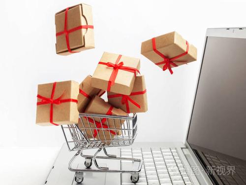 笔记本电脑键盘上的购物车上的纸盒电子商务的想法买卖商品或服务在线